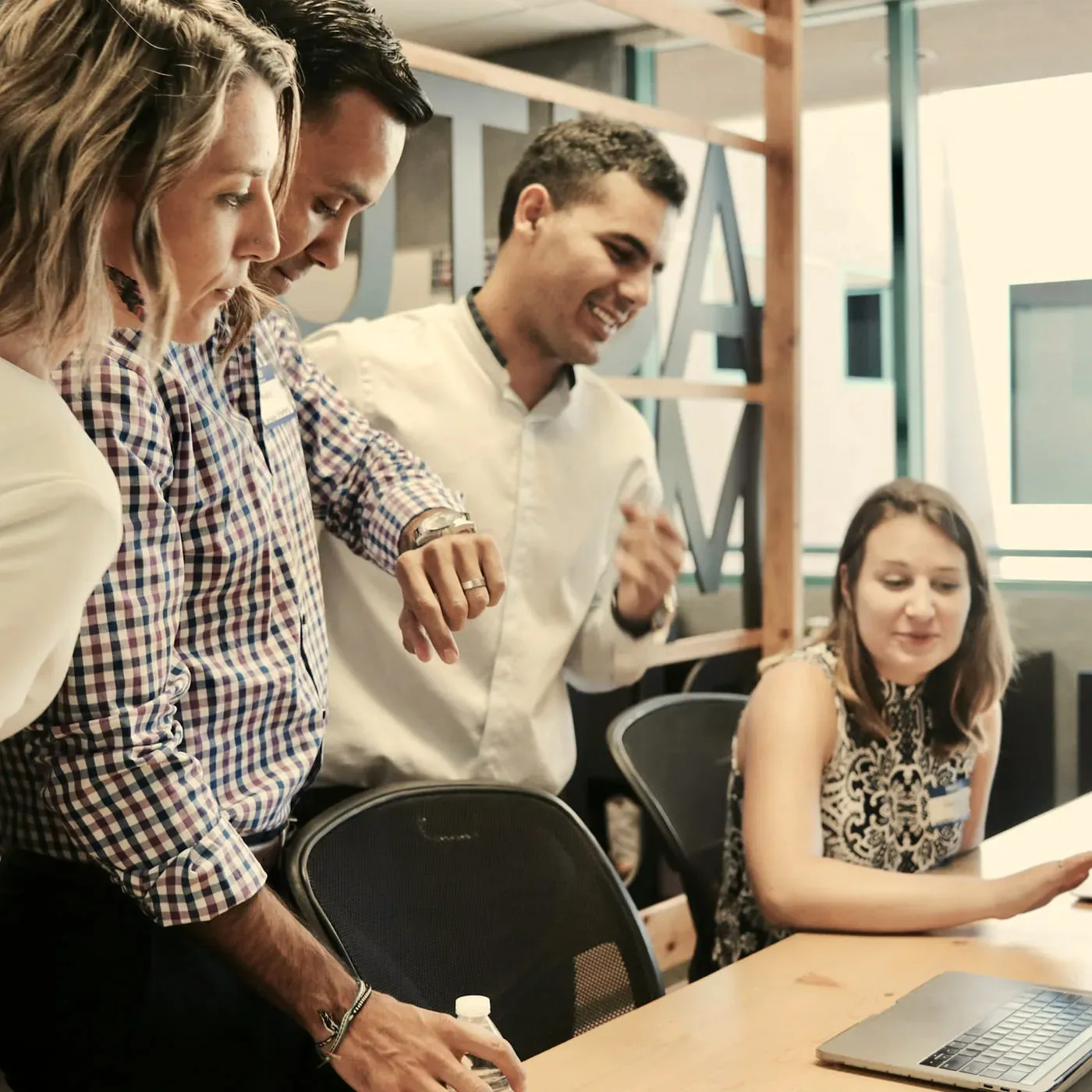 A team reviewing results together on a laptop